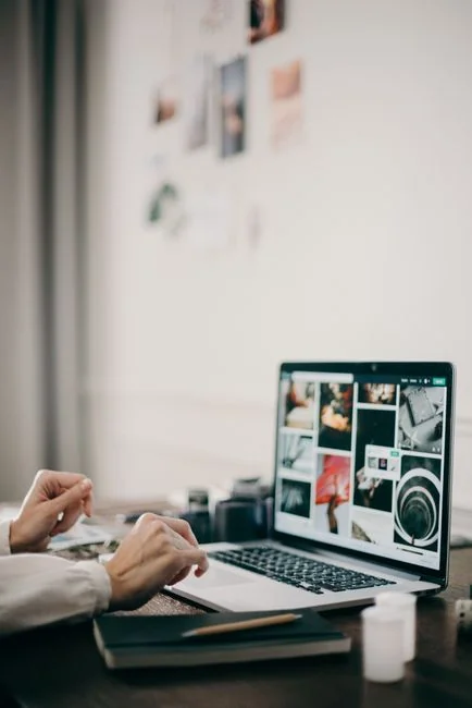 Businesswoman working on laptop with Android 6.0 Marshmallow webpage open.